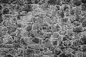 Abstract traditional stone wall pavement texture background. Bumpy textured stonewall made from flagstone and slabstone