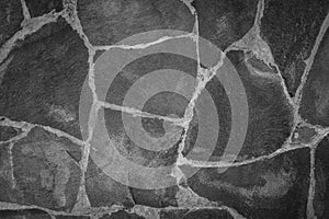 Abstract traditional stone wall pavement texture background. Bumpy textured stonewall made from flagstone and slabstone