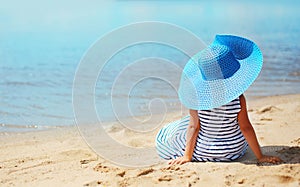 Abstract travel photo pretty little girl in dress and hat