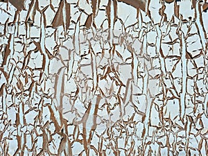 Abstract uncorked wall background. Rough texture. Peeling paint and rusty old metal background. Patterns and texture