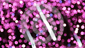 Abstract unfocused backgrounds with Christmas decorations with purple led light bokeh and white ligt comets