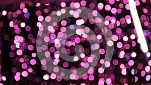 Abstract unfocused backgrounds with Christmas decorations with purple led light bokeh and white ligt comets