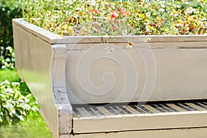 Abstract upright pianos in wood with flowers