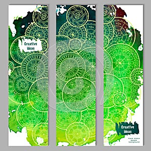 Abstract vector hand drawn doodle floral pattern card set. Green watercolor texture with white mandalas.