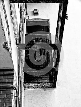 Abstract view of demolished concrete slab and wooden entrance door