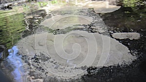 Abstract view of drinkable erupting fresh water source in nature. Natural crystal clear water comes from underground and makes the