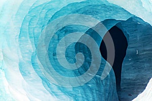 Abstract view of the entrance of an ice cave in the glacier Mer de Glace, in Chamonix Mont Blanc Massif, The Alps France photo