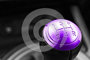 Abstract view of a gear lever, manual gearbox, car interior details. Black and white, red.