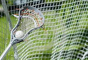 Abstract view of a lacrosse stick scooping up a ball