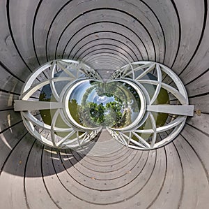 Abstract view of little planet transformation of spherical panorama 360 degrees. Spherical abstract aerial view on wooden bridge.