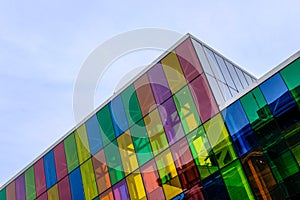 Abstract view of a modern, IT based building and offices showing the coloured glass windows.