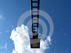 Abstract view of modern square head street lamp with blue sky