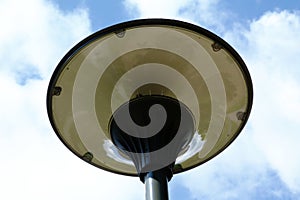 Modern corcular street lamp. milky white glass lens and gray aluminum light pole