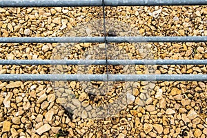 Abstract view of newly laid hardcore rubble seen at the entrance to a farm.