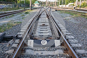 Abstract view of railway arrows. A turnout switch for rails in railway traffic. Rails, sleepers and crushed stone on the railway