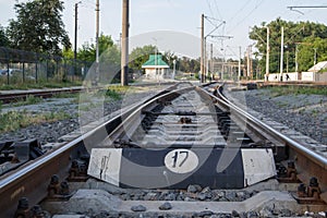 Abstract view of railway arrows. A turnout switch for rails in railway traffic. Rails, sleepers and crushed stone on the railway