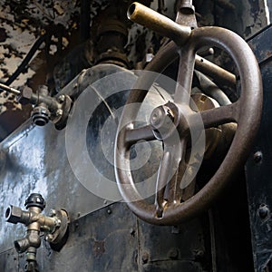 Abstract vintage industrial background featuring close up view of old steam locomotive controls