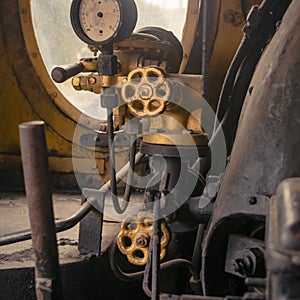 Abstract vintage industrial background featuring close up view of old steam locomotive controls