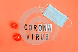 Abstract virus strain model of Coronavirus disease COVID-19 , face mask and text onred background