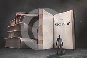 Abstract vision of a businessman standing in front of a huge book with recession inscription