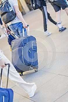 Abstract walking man with suitcase and backpacks, the concept of emigration, departure. Intentional sloping level