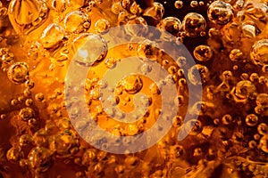 Abstract water with  bubbles soars over a golden background