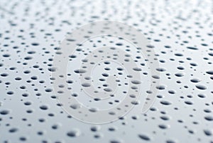 Abstract of Water Rain Drop on Car Glass, Drops over Black Shinny Background.