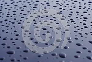 Abstract of Water Rain Drop on Car Glass, Drops over Black Shinny Background. Texture Dark Blue.
