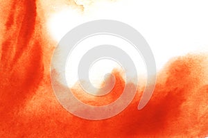 Abstract watercolor background. Smooth spots of orange dissolve in the background. The gradient from saturated red to white. Hand