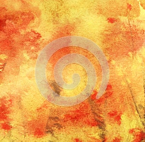 Abstract watercolor background. Yellow, red orange. Fall season. Chaotic spots of warm shades. Watercolor gradient. Colorful