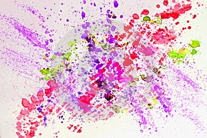 Abstract watercolor bright colorful background painting with spray, spots, splashes. Hand drawn on paper grain texture