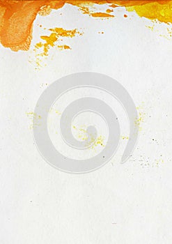 Abstract watercolor painted background with orange and yellow paint spots on textured paper