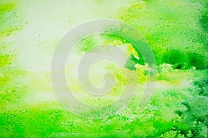 Abstract watercolor. Yellow green pattern. Paint stains on paper. Artistic background with space