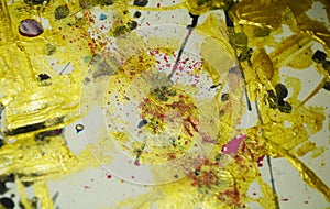 Abstract waxy spotted paint gold dark colors, brush strokes, organic hypnotic background