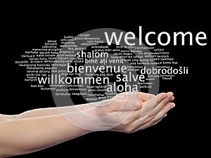 Abstract welcome or greeting international word cloud in hand, different languages or multilingual 