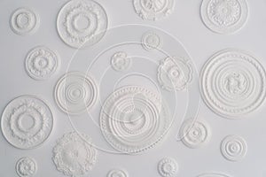 Abstract White Circular Bas-Relief Sculptures on a Clean Background