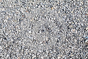 Abstract white crushed stones texture background. Gray rubble construction rock pebble pattern.