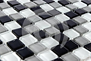 Abstract white, Grey and black ceramic mosaic wall tiles texture for bathroom, separate background for copy space, side view