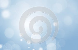 Abstract White Light Magical Bokeh Light. Festive Celabration Blue Background. Blurred Shiny Bokeh Background