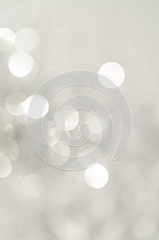 Abstract white and silver background with bokeh.