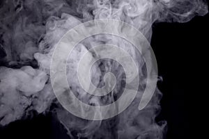 Abstract white smoke against dark background