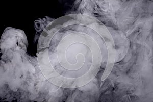 Abstract white smoke against dark background