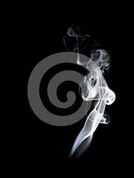 Abstract white smoke swirls on black background.