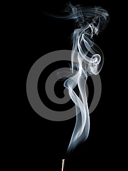 Abstract white smoke swirls on black background.