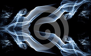 Abstract white smoke swirls on black background.