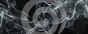 Abstract white smoke swirls on dark background