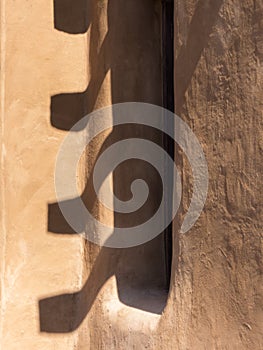 Abstract, window in adobe wall