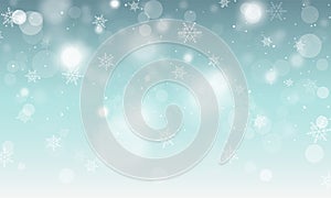 Abstract winter blue background with snowflakes and glowing elements.