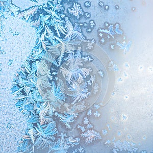 Abstract winter frost patterns on window, festive background, cl