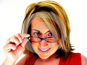 Abstract - Woman looking over glasses